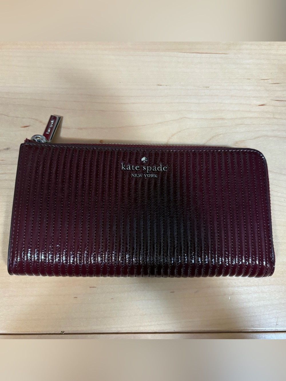 kate spade patent ribbed wallet in deep burgundy